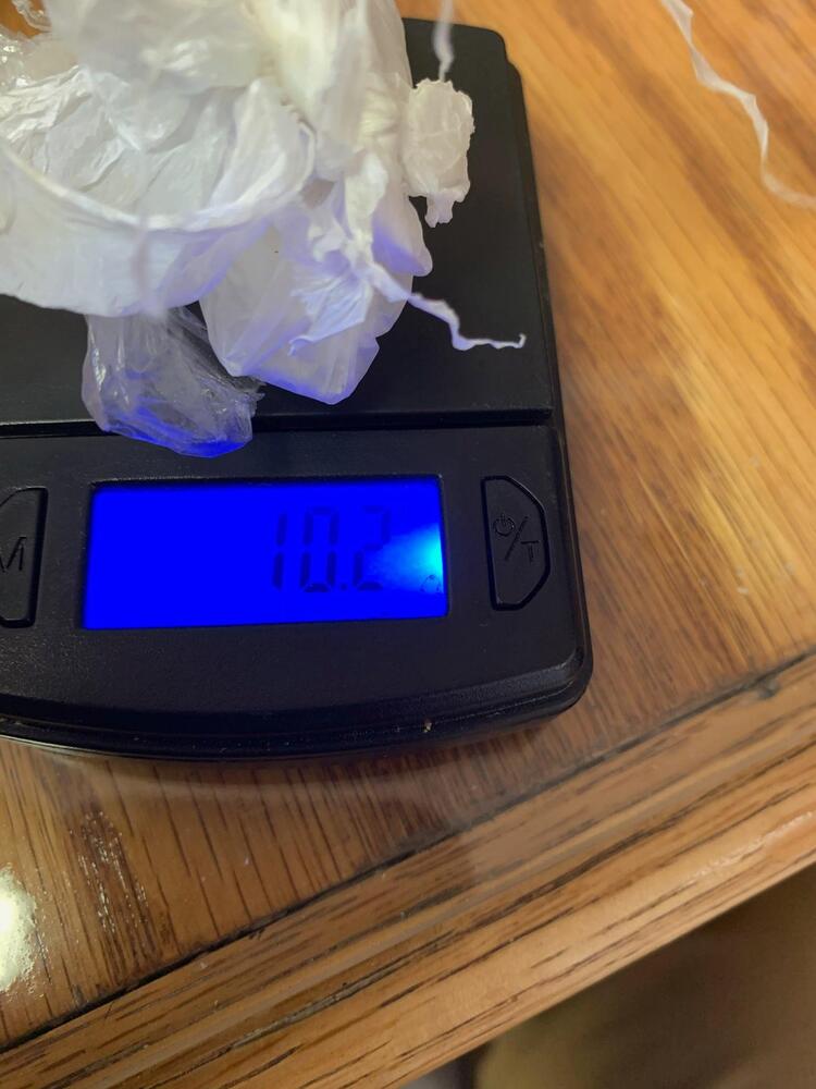 Bag of illegal drugs on a digital scale
