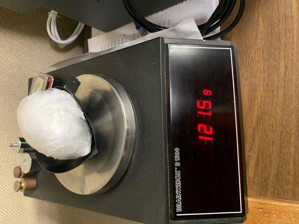Bag of illegal drugs on a digital scale on a table